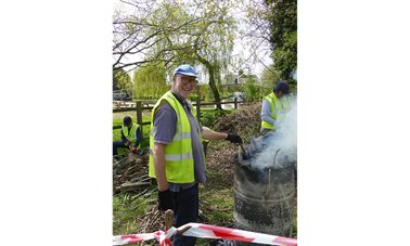 Geoff gets the incinerator going