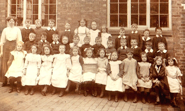 children outside old village school